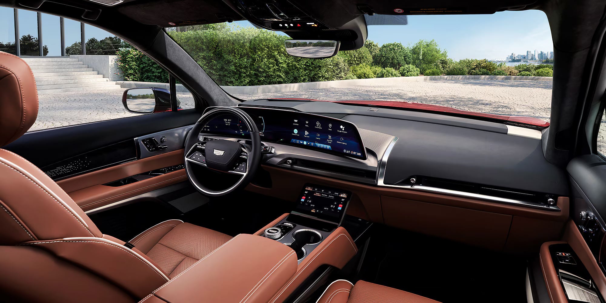 2026 Cadillac VISTIQ interior showcasing digital driver display with advanced safety alerts, wide infotainment screen, and driver-assistance technology integration.